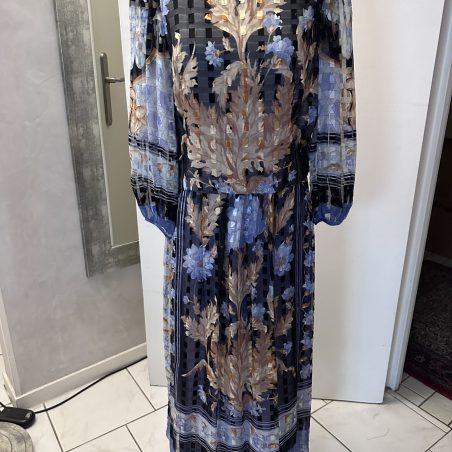 Retouche couture et finitions main par Rassa Shanta, couturière formée chez Lanvin et Saint-Laurent